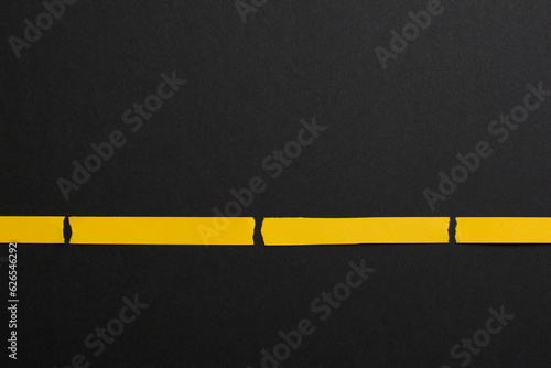 Black background divided with yellow stripes, lines