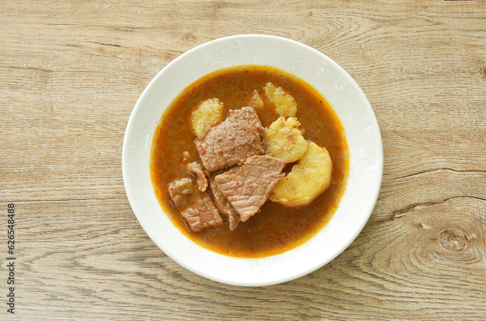beef curry or Mussamun Indian food with slice potato on plate beef curry or Mussamun Indian food with slice potato on plate
