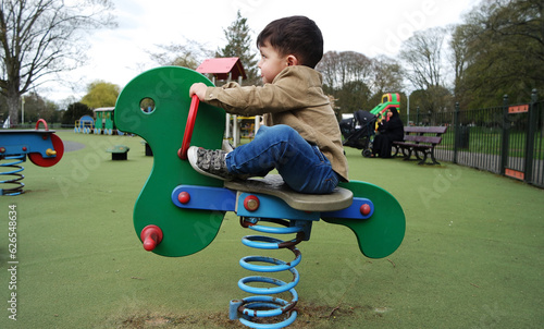 Beautiful Close up Portrait of an Asian Pakistani Baby Boy Named Ahmed Mustafain Haider is Posing at Wardown Public and Children Park of Luton, England UK. Image Was Captured on April 03rd, 2023.	 photo