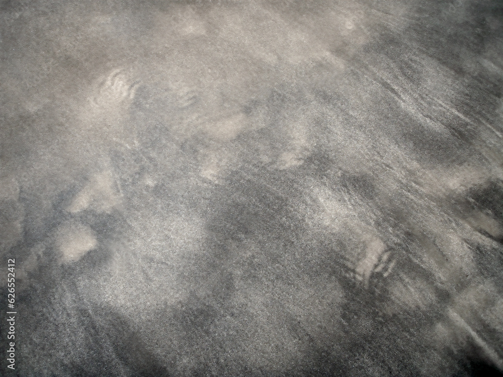 Naklejka premium Sandy beach background with an old-fashioned sober monotone smoky impression (Retouched image)