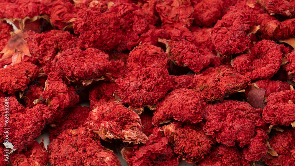Dried pomegranate flower as a background.