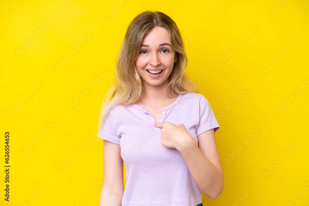 Blonde English young girl isolated on yellow background with surprise facial expression Blonde English young girl isolated on yellow background with surprise facial expression