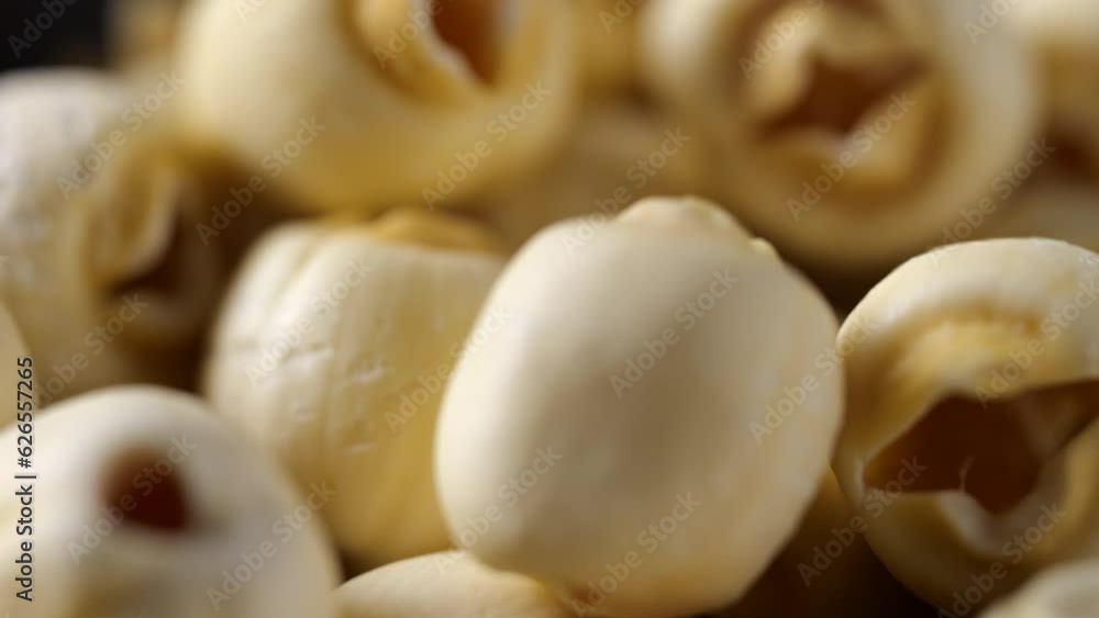 Closeup of white dry lotus seeds, grain nutrition. Slide and moving camera in slow motion Closeup of white dry lotus seeds, grain nutrition. Slide and moving camera in slow motion