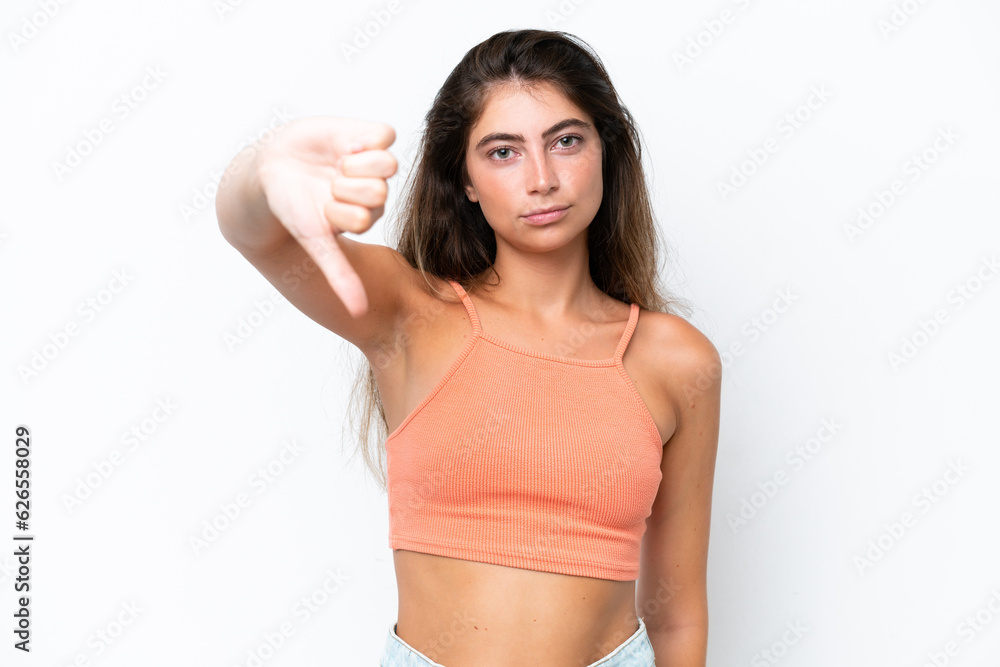 Young caucasian woman isolated on white background showing thumb down with negative expression Young caucasian woman isolated on white background showing thumb down with negative expression