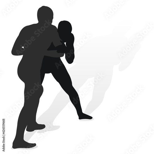 Image of a silhouette of a wrestler athlete in a fighting pose. Greco Roman wrestling, combating, duel, fight, martial art, sportsmanship