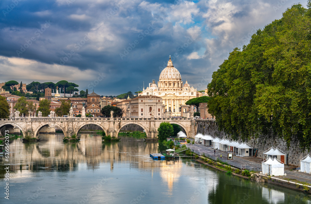 St.Peter's basilica viewed across Tiber river in Vatican in Rome. Italy