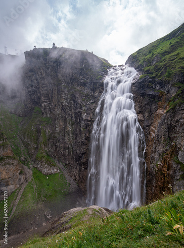 Engstligen fall in Adelboden on a cloudy day with a mystic mood in the Swiss alps