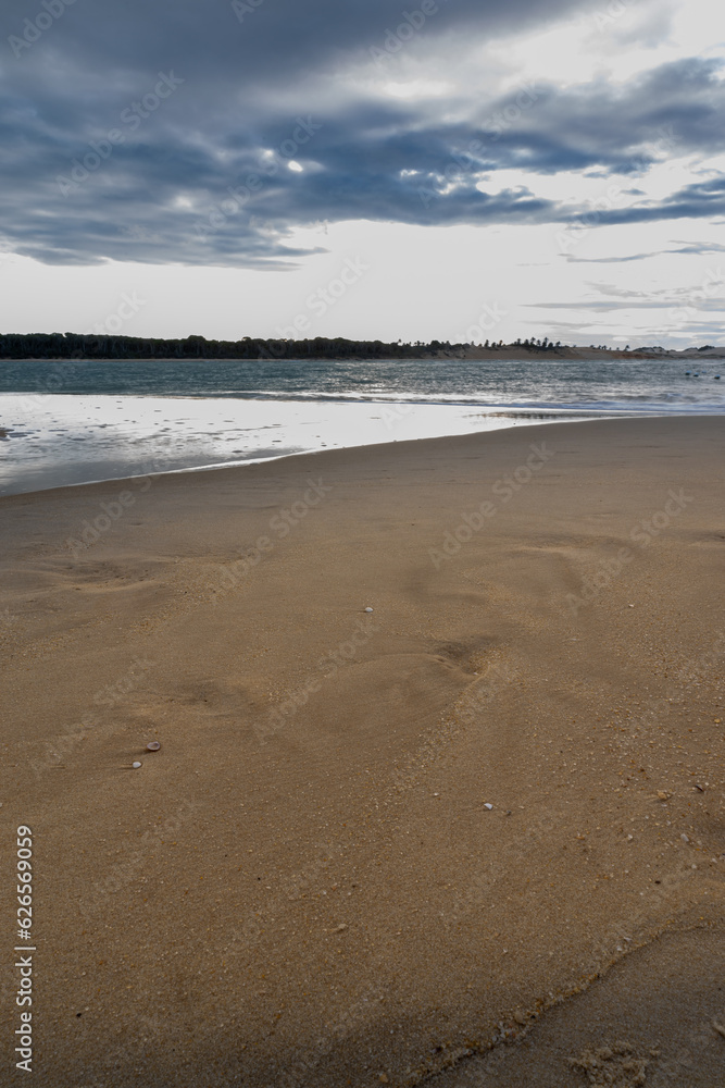 Beautiful bay with a lonely beach. Vertical photography.