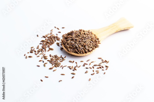 Dill, European Dill ,American Dill (Anethum graveolens  L.) in wooden spoon. Dried herb seeds isolated in white background.
