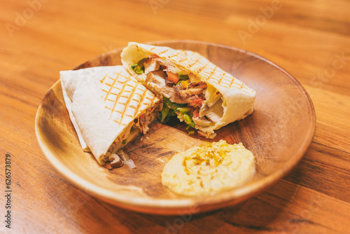 Rosemary chicken wrapaninis on wooden plate