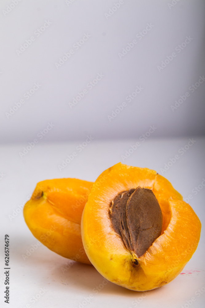 cut apricot on a white background, isolated