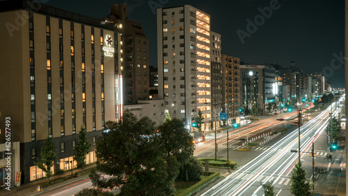 Long exposure shot of busy night traffic with cars in Kyoto city Japan