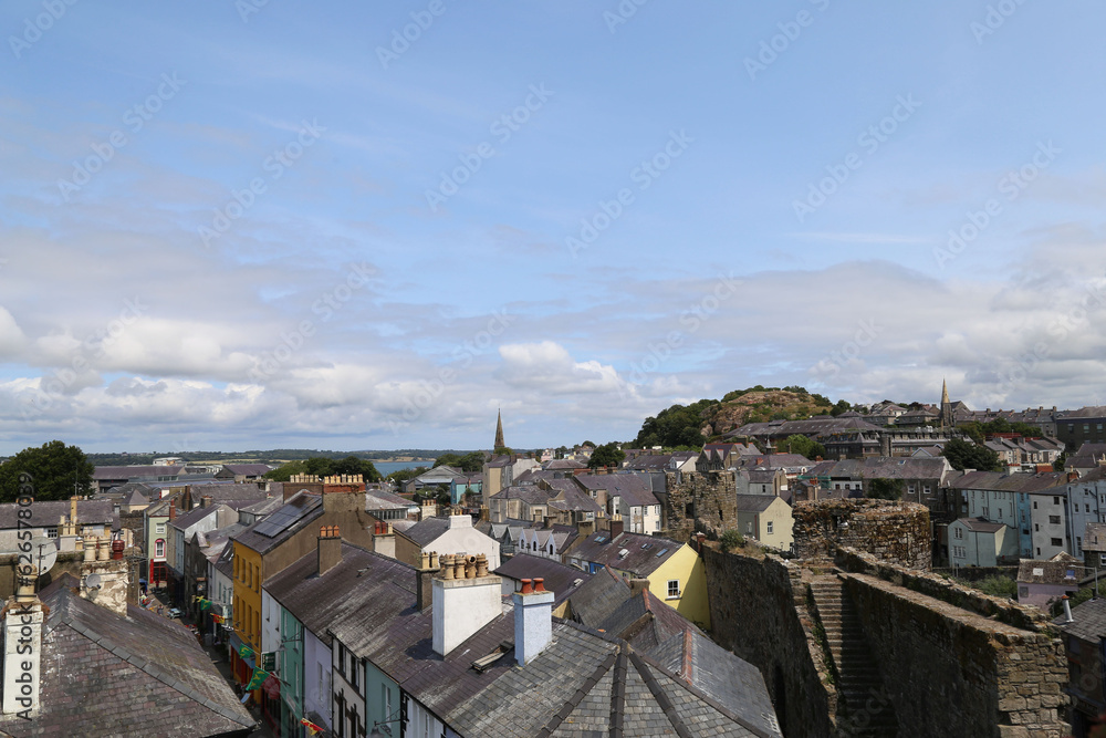  A view across the slate rooftops of Caernarfon, Wales, UK, towards the Menai Strait and Anglesey.