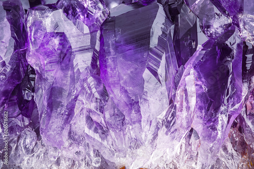 amethyt quartz geode macro detail texture background. close-up raw rough unpolished semi-precious gemstone druse