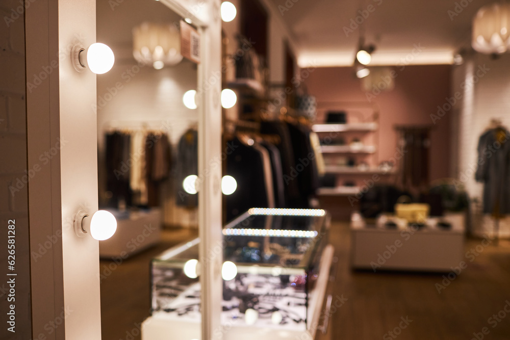 Background image of big vanity mirror in clothing boutique interior, copy space Background image of big vanity mirror in clothing boutique interior, copy space