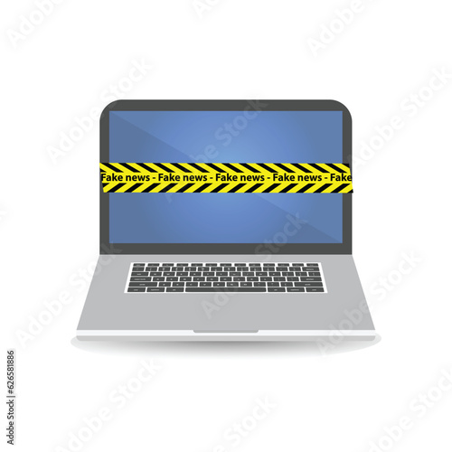 Yellow tape line with black stripes and the text fake news on a laptop