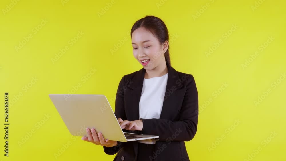 Portrait young asian businesswoman using laptop and think idea for planning and decide with successful on yellow background, happiness business woman working on notebook with thoughtful for success. Portrait young asian businesswoman using laptop and think idea for planning and decide with successful on yellow background, happiness business woman working on notebook with thoughtful for success.