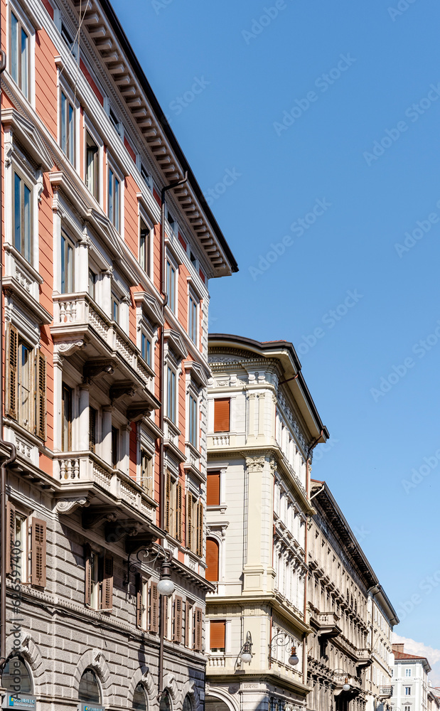Buildings and street of Borgo Teresiano, an elegant district built in the 18th century at the behest of Maria Theresa of Austria, Trieste city center, Italy