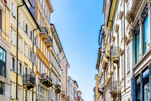 Buildings and street of Borgo Teresiano, an elegant district built in the 18th century at the behest of Maria Theresa of Austria, Trieste city center, Italy