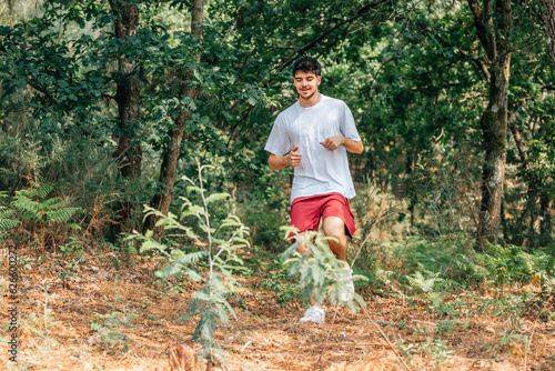 young man running outdoors cross country
