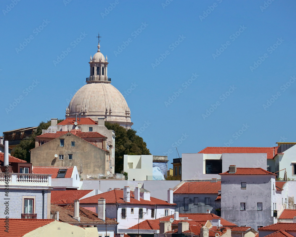 famous church monument in lisbon portugal surrounded by roofs and classic european architecture buildings (travel, tourism, sightseeing) historic city center