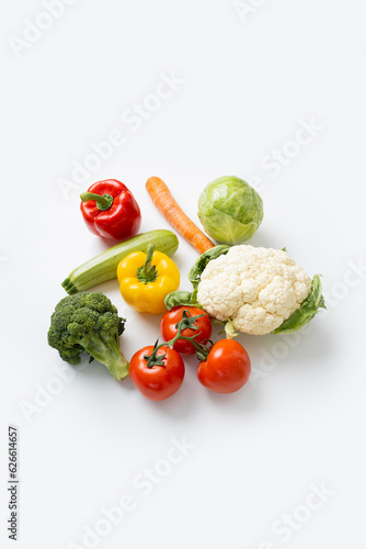 Fresh vegetables on a white background. Top view, flat lay