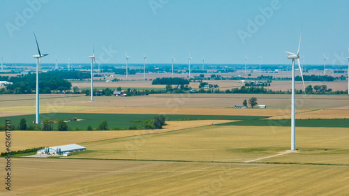 Aerial wind farm in farmland rural area on summer day