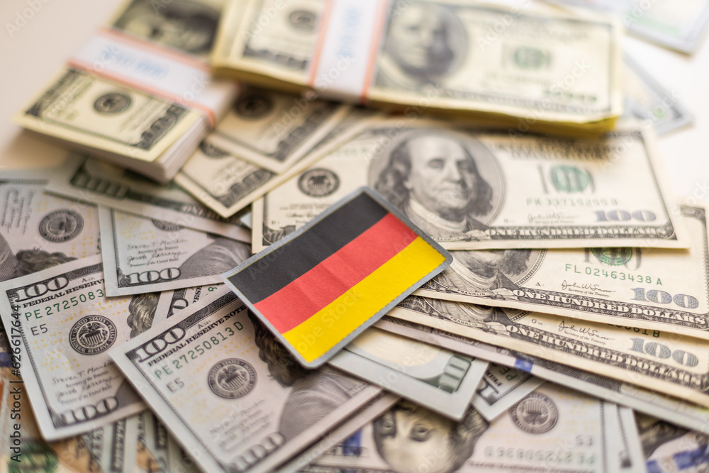Flag of Germany sticking in a variety of american banknotes.(series) Flag of Germany sticking in a variety of american banknotes.(series)
