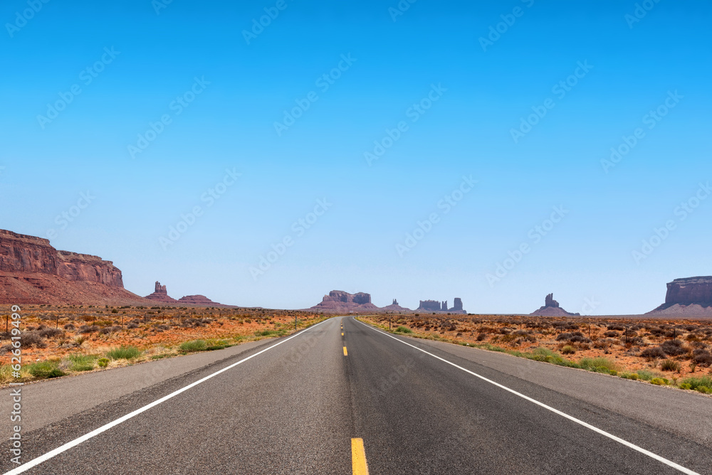 Road to Monument Valley in the American west on a partially cloudy day Road to Monument Valley in the American west on a partially cloudy day