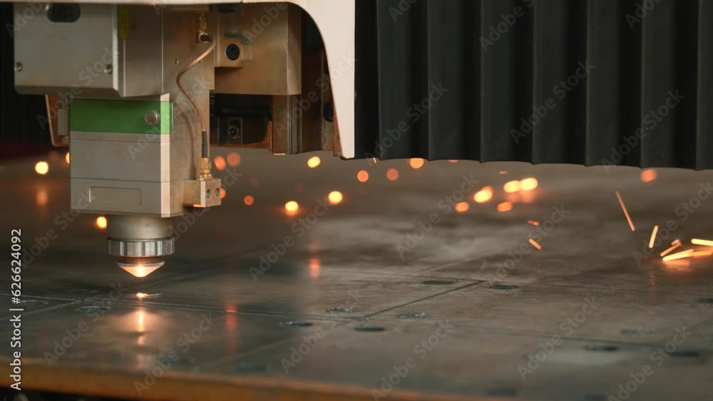 Metalworking Exhibition and a laser cutting machine working with sheet metal. Creative. Industrial, equipment, technology and manufacturing concept.