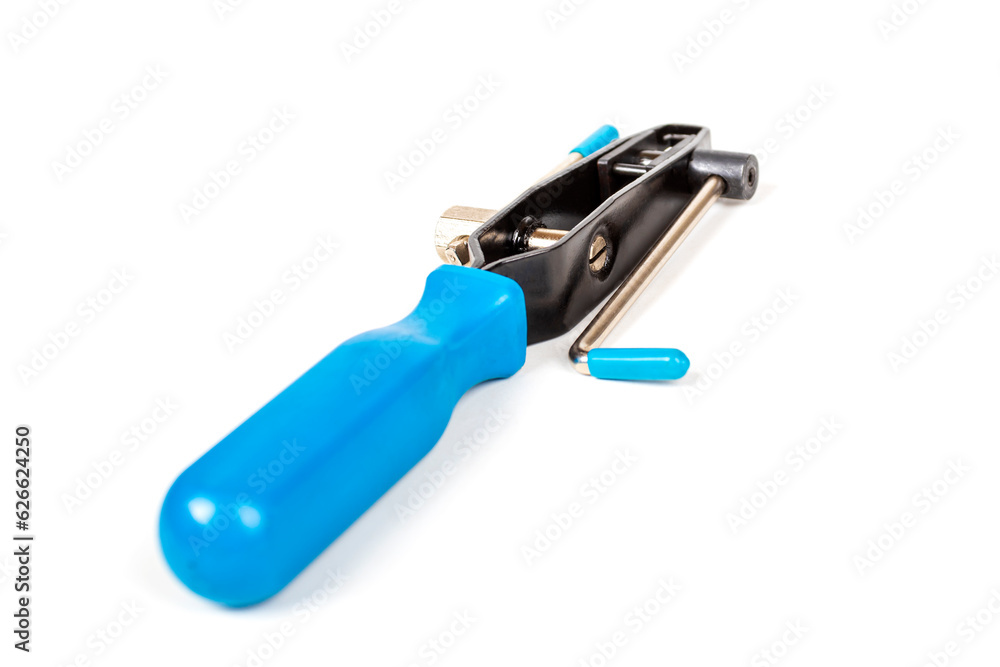 white background. a tool for tightening metal rings. close-up white background. a tool for tightening metal rings. close-up