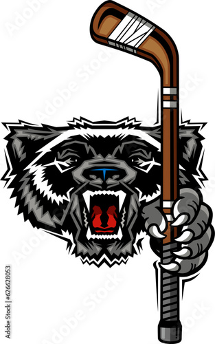 angry wolverine mascot holding hockey stick for school, college or league sports