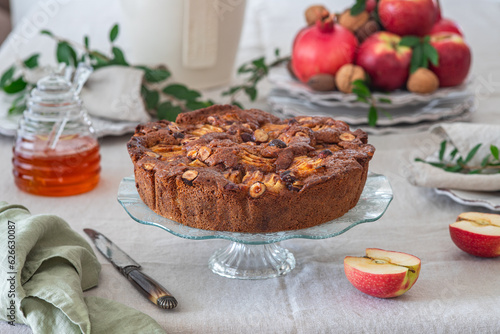 Apple cake with hazelnuts and cinnamon. Rosh hashanah jewish New Year holiday concept.