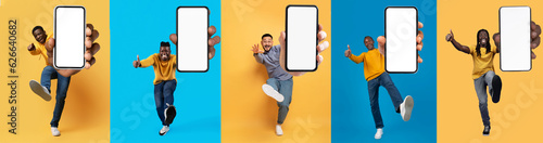 Overjoyed multiethnic guys showing phones while jumping on colorful backgrounds