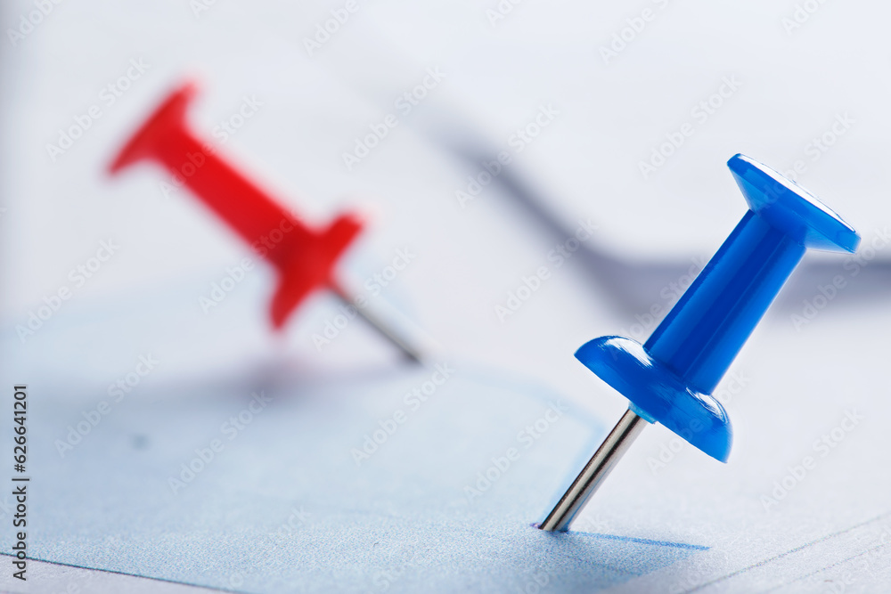 Marking financial chart by pins.Share listing and checking financial chart. Concept of banking, financial report and financial audit. Marking financial chart by pins.Share listing and checking financial chart. Concept of banking, financial report and financial audit.