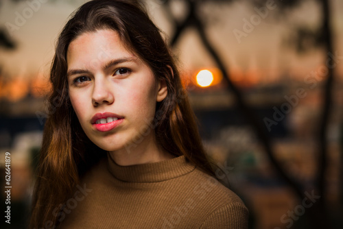 Headshot teen portrait outdoors. Hispanic Cuban attractive girl in casual clothes lifestyle