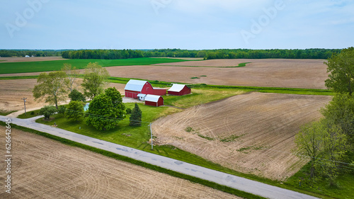 Obraz na plátně Property farm farmhouse barn and shed green pasture empty plowed fields with pav