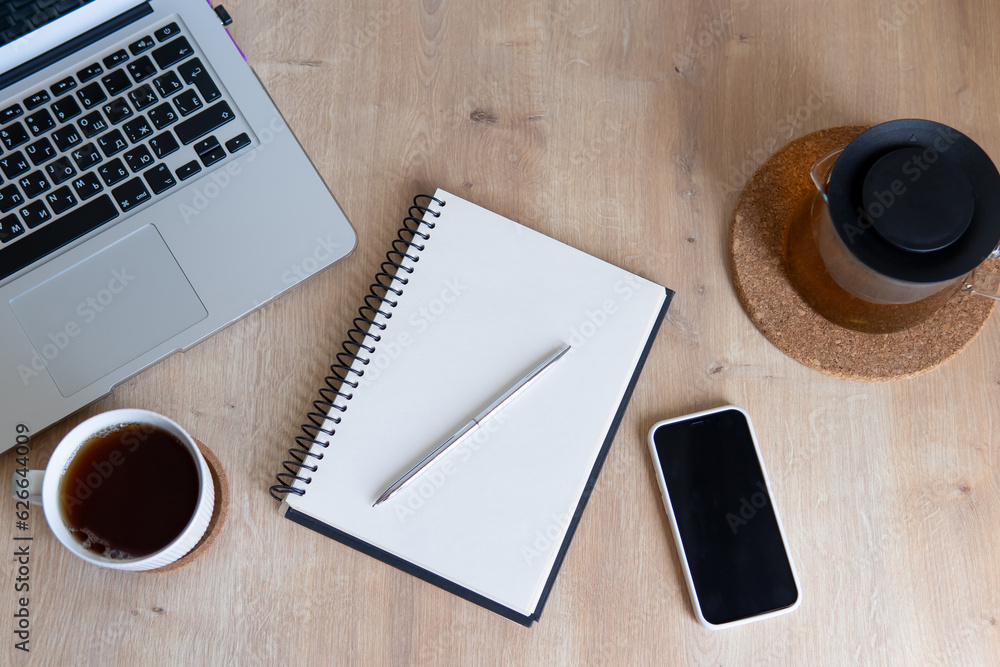 laptop: notepad phone and coffee on desktop top view coffee break composition in the middle of the day laptop: notepad phone and coffee on desktop top view coffee break composition in the middle of the day