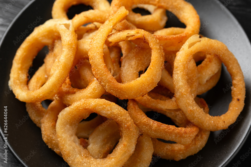 Crunchy Fried Battered onion rings on black plate