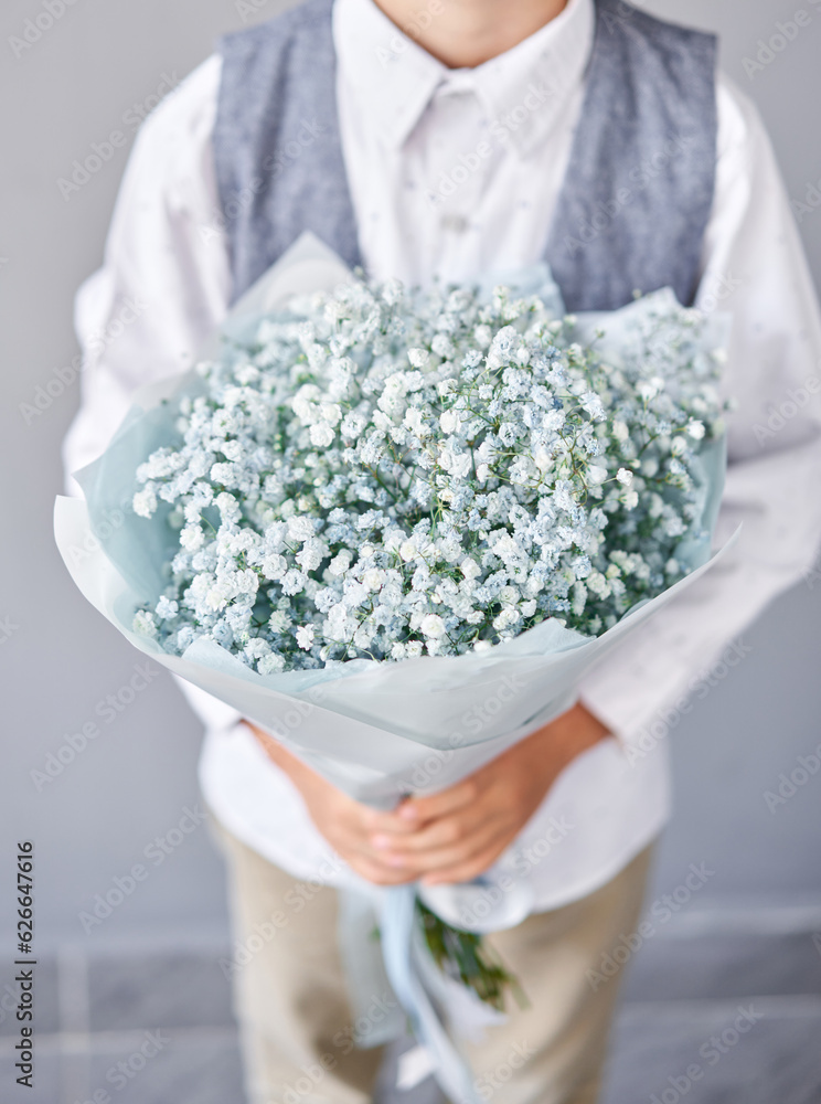 Gypsophila. Beautiful bouquet of mixed flowers in boys hands. the work of the florist at a flower shop. Fresh cut flower. Gypsophila. Beautiful bouquet of mixed flowers in boys hands. the work of the florist at a flower shop. Fresh cut flower.