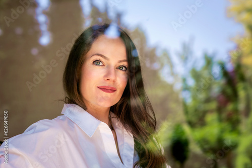 Wallpaper Mural Beautiful young woman with brunette hair and blue eyes standing behind the window Torontodigital.ca
