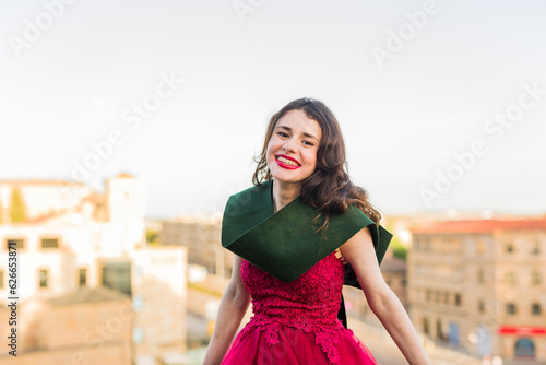 Education college graduate, happy student. Hispanic woman in Salamanca, Spain, outdoors smiling 