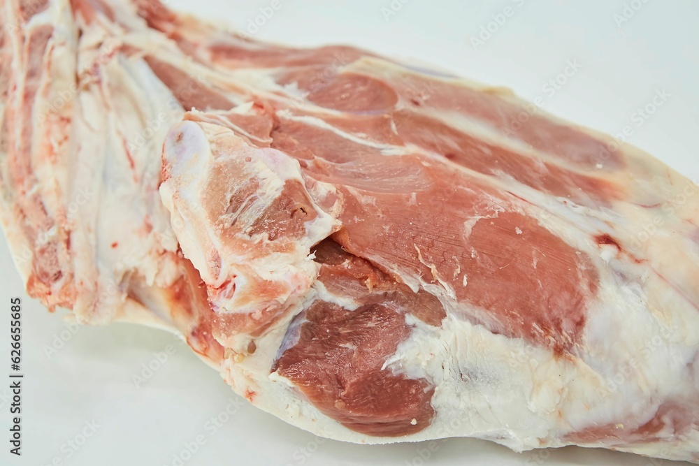 Raw meat on a white background. Pork, beef or lamb. Steak or tenderloin. Different parts of meat products for different dishes. Raw meat on a white background. Pork, beef or lamb. Steak or tenderloin. Different parts of meat products for different dishes.