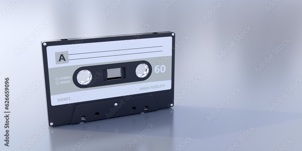 Obraz premium Retro audio cassette tape with blank label on grey background