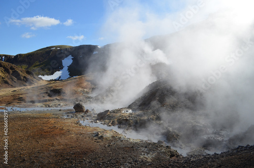Geothermal Steam Rising from Active Volcanic Landscape