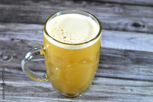 Sugarcane juice, the liquid extracted from pressed sugarcane. It is consumed as a beverage in India, North Africa, Latin America, Southeast Asia, obtained by crushing peeled sugar cane in a mill photo