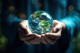International Day of Forests and earth day concept. Hands holding blue earth globe in business hands on green blurred background for world environment day