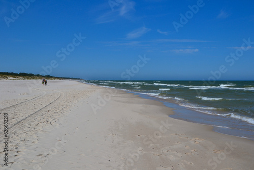 Baltic Sea coast and wild beach next to moving dunes in the Slovincian National Park also known as Slowinski National Park. Leba  Poland 
