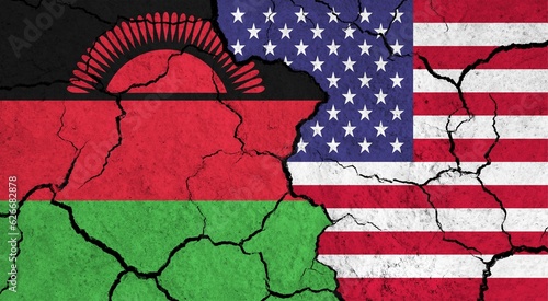 Flags of Malawi and USA on cracked surface - politics, relationship concept