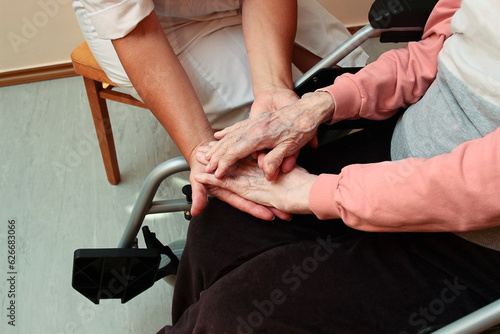 A rehabilitation specialist exercises with an elderly woman